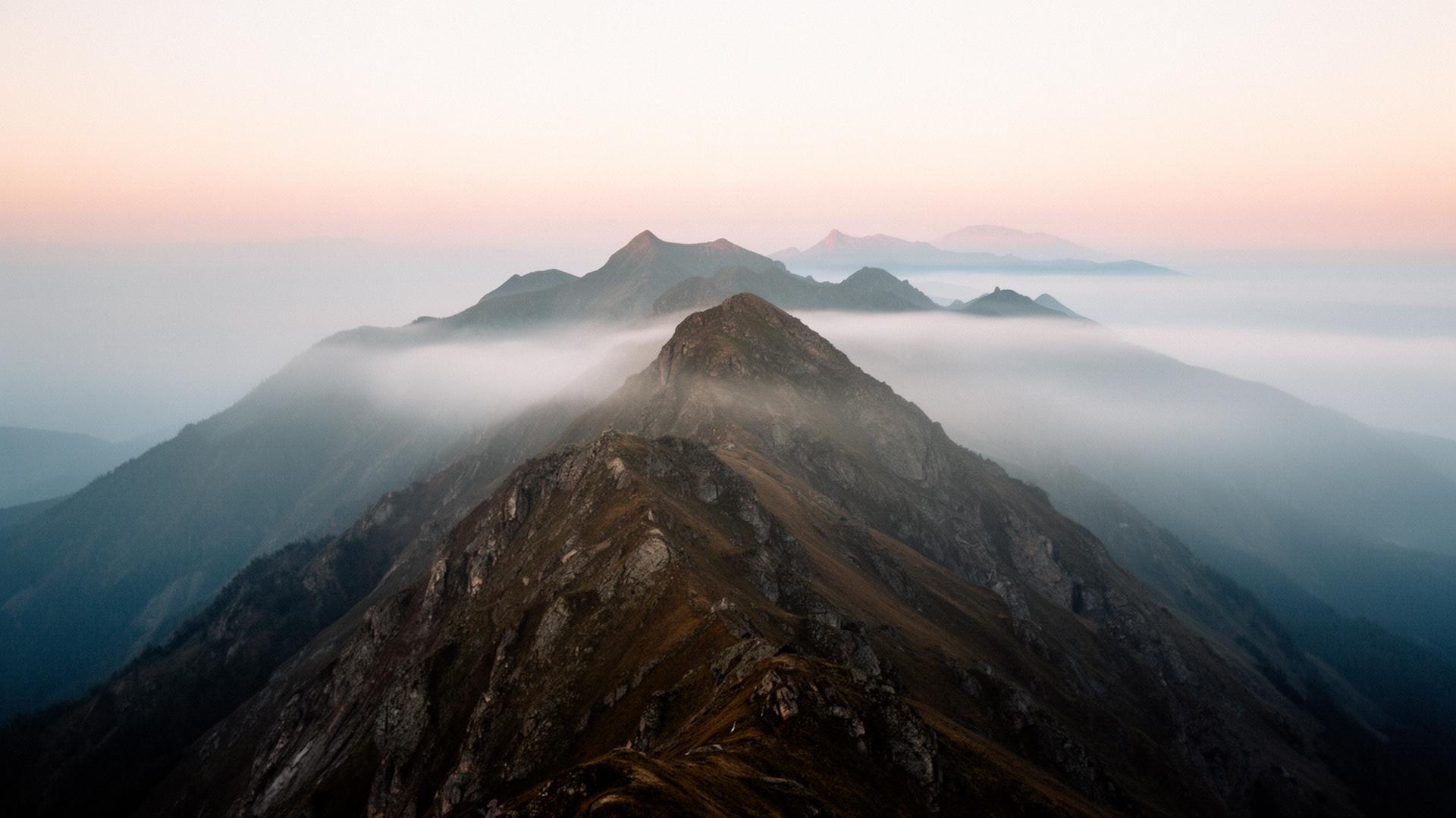 Misty mountain ridge at dawn